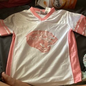 Brand:NFL Size: Medium (7-8) Color: White and pink